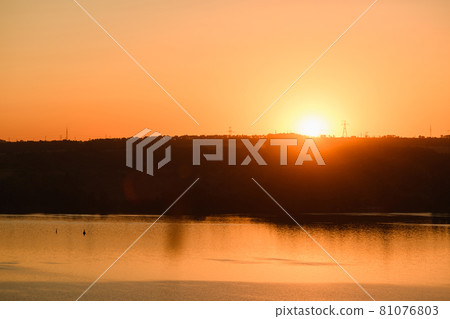 Vibrant river sunrise with orange raising sun 81076803