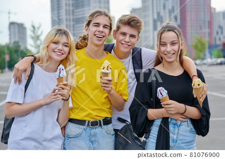 Group portrait of happy teenagers having fun with ice cream. Group portrait of happy teenagers having fun with ice cream. 81076900
