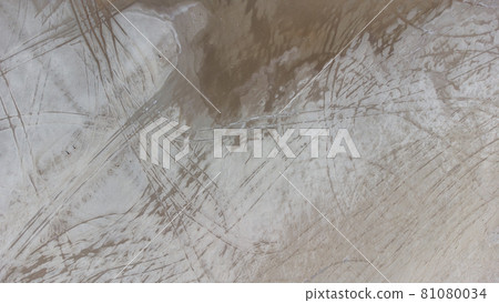 The bottom of a dried up salt lake. View from the air. Traces of cars and motorcycles in the sand. The bottom of a dried up salt lake. View from the air. Traces of cars and motorcycles in the sand. 81080034