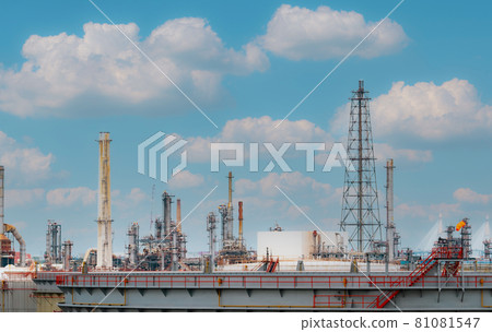 Oil refinery or petroleum refinery plant with blue sky background. Power and energy industry. Oil and gas production plant. Petrochemical industry. Natural gas storage tank. Petroleum business. 81081547