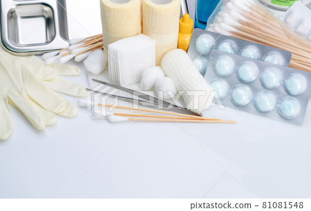 Wound care dressing set. Forceps, cotton stick, conform bandage, elastic cohesive retention bandage, cotton ball with alcohol, latex disposable gloves, and povidone-iodine. Medical supply for nurses. 81081548