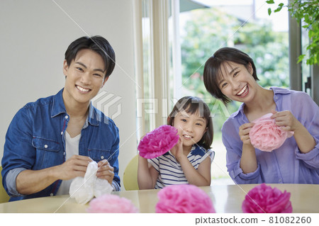 Young family relaxing in the living room Young family relaxing in the living room 81082260