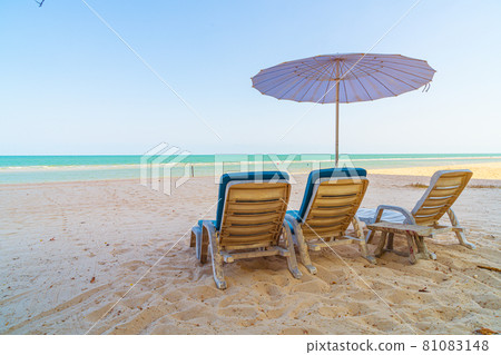 beach chair on sand with ocean sea background beach chair on sand with ocean sea background 81083148