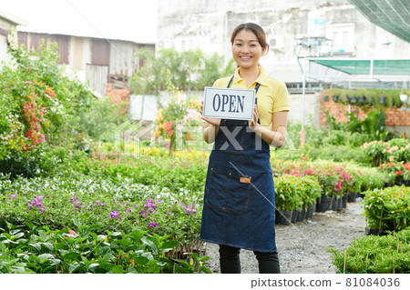 Woman Opening Plant Nursery Woman Opening Plant Nursery 81084036