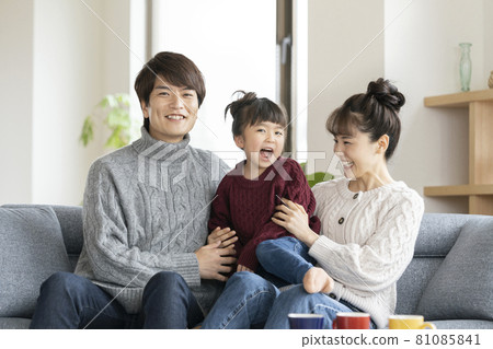 Portrait of a family of three with a smile Portrait of a family of three with a smile 81085841
