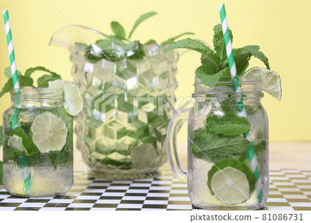 Fresh Mojito Cocktails on Checkered Table in Cafe 81086731