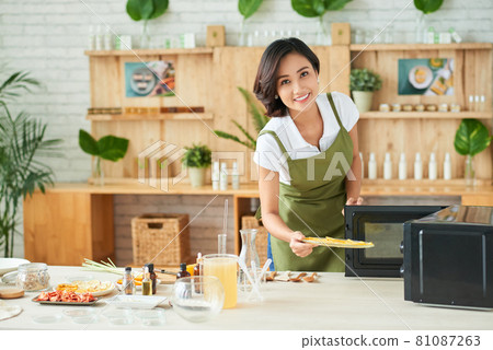 Woman Drying Orage Slices 81087263