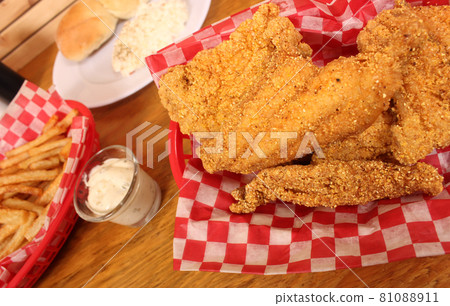 Fried Catfish With Coleslaw and French Fries in Rural Cafe 81088911