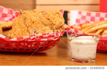Fried Catfish With Tartar Sauce and French Fries in Cafe 81088930