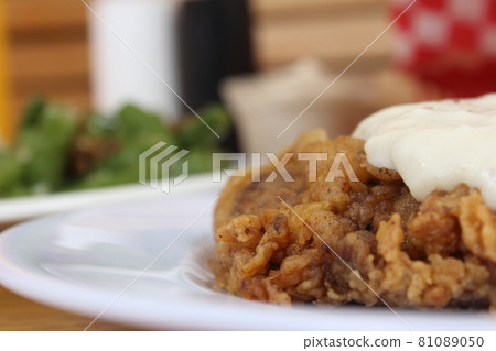 Chicken Fried Steak and Gravy With Mashed Potatoes in Rural Cafe Restaurant 81089050