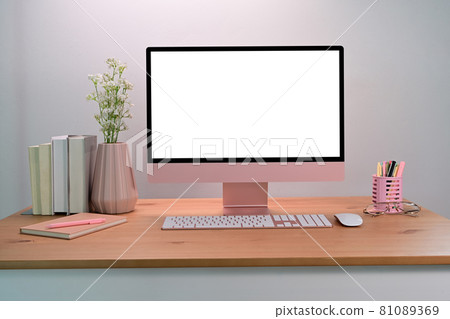 Computer with blank screen on wooden table. Female workspace. Computer with blank screen on wooden table. Female workspace. 81089369