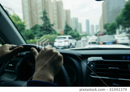 Driving car in modern city Driving car in modern city 81091379