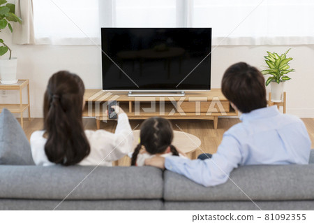 TV placed in the living room, back view of the family watching TV TV placed in the living room, back view of the family watching TV 81092355