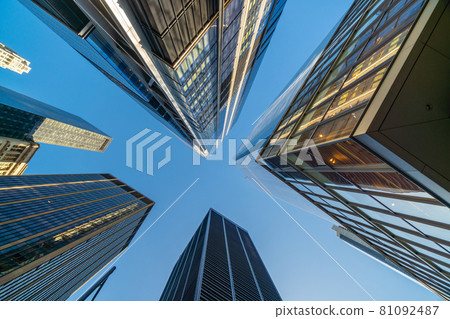 Looking up at business buildings in downtown New York City 81092487