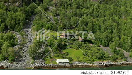 Geirangerfjorden, Norway. Geirangerfjord Coast Harbor In Spring Landscape. View From Floating Touristic Ship Ferry Boat In Summer Day. Norwegian Landmark And Popular Destination Geirangerfjorden, Norway. Geirangerfjord Coast Harbor In Spring Landscape. View From Floating Touristic Ship Ferry Boat In Summer Day. Norwegian Landmark And Popular Destination 81092524