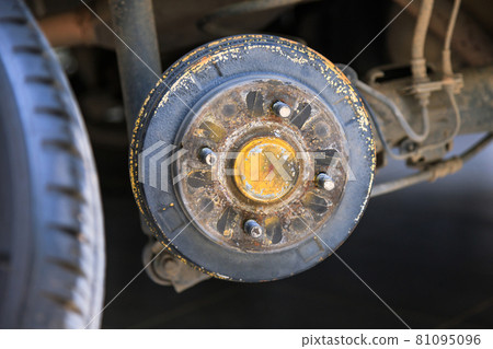 A rear hub of the car after removing a tire and wheel, maintaining a brake and wheel system, car jack-up for change a car wheel, Close-up shot A rear hub of the car after removing a tire and wheel, maintaining a brake and wheel system, car jack-up for change a car wheel, Close-up shot 81095096