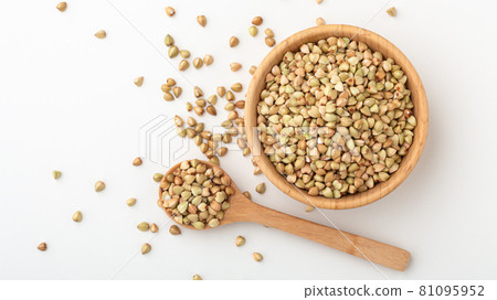 Buckwheat in wood bowl with spoon Buckwheat in wood bowl with spoon 81095952