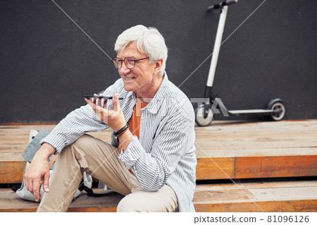 Active Senior Man using Smartphone in City Active Senior Man using Smartphone in City 81096126
