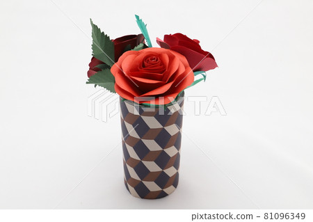 Handmade rose flowers made from origami are displayed in a beautiful vase Handmade rose flowers made from origami are displayed in a beautiful vase 81096349