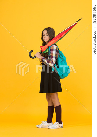 Schoolgirl daily life. Girl with umbrella. Happy childhood. 81097669