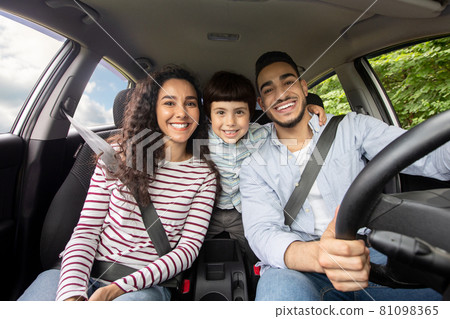 Happy Arab Family With Son Sitting In Car And Smiling At Camera Happy Arab Family With Son Sitting In Car And Smiling At Camera 81098365