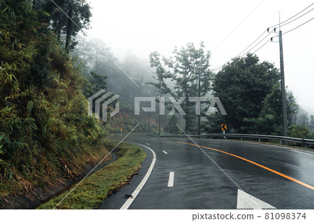 Mountain road in rainy and foggy day Mountain road in rainy and foggy day 81098374