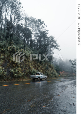 Mountain road in rainy and foggy day Mountain road in rainy and foggy day 81098375