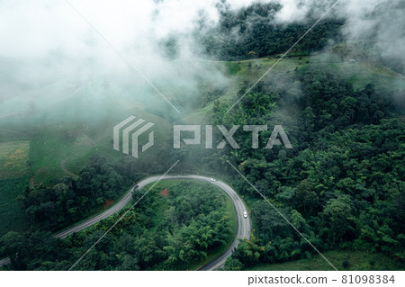 Mountain road in rainy and foggy day Mountain road in rainy and foggy day 81098384
