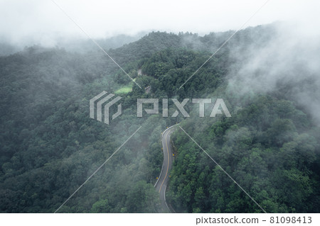 Mountain road in rainy and foggy day Mountain road in rainy and foggy day 81098413