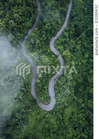 Mountain road in rainy and foggy day Mountain road in rainy and foggy day 81098432