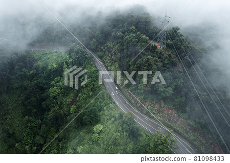Mountain road in rainy and foggy day Mountain road in rainy and foggy day 81098433