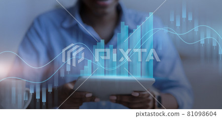 Businesswoman using digital tablet, checking stock market, double exposure 81098604