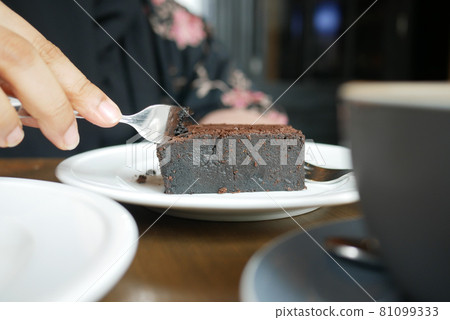slice of brownie on plate on table  81099333