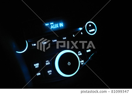 Automobile stereo in neon light at night. Dashboard with audio equipment in cabin of the modern new car 81099347