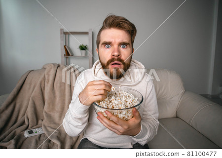 Portrait of guy watching TV series online. Online cinema and video streaming service concept. 81100477