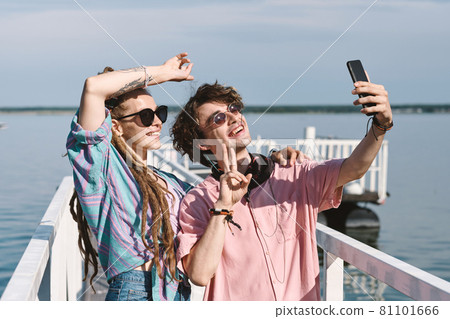 Couple Taking Selfie on Pier 81101666