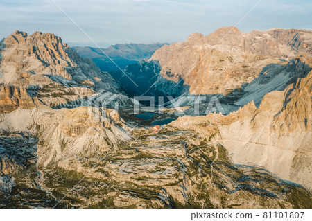 Incredible nature aerial landscape around famous Tre Cime di Lavaredo. Rifugio Antonio Locatelli alpine hut popular travel destination in the Dolomites, Italy Incredible nature aerial landscape around famous Tre Cime di Lavaredo. Rifugio Antonio Locatelli alpine hut popular travel destination in the Dolomites, Italy 81101807
