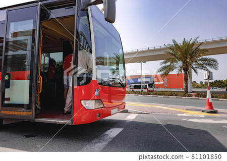 A close up shot of a regular old red bus 81101850