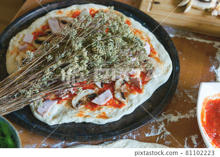 Preparing the Italian pizza Preparing the Italian pizza 81102223