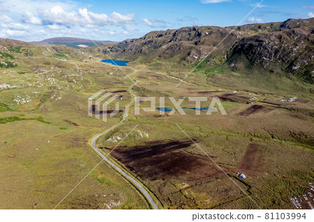 The road to An Port between Ardara and Glencolumbkille in County Donegal - Ireland. 81103994