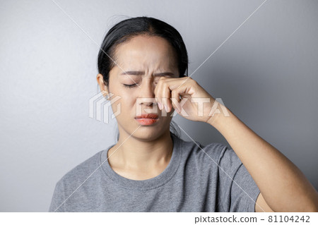 Woman suffering from strong eye pain. Woman suffering from strong eye pain. 81104242