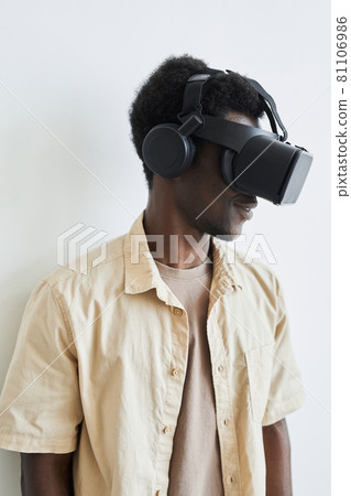 Man in VR glasses playing video game 81106986