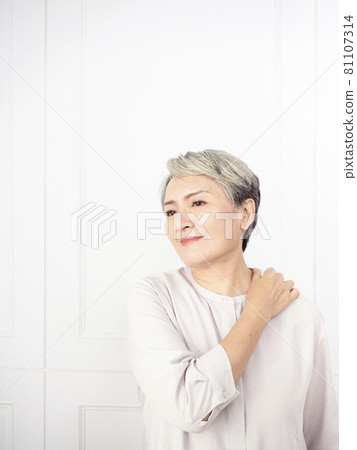 Sick Asian mature woman touching neck having shoulder and neck pain. Healthcare and medicine concept. 81107314