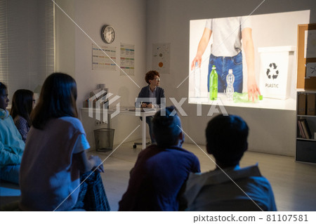 Schoolchildren watching video about recycling plastic bottles Schoolchildren watching video about recycling plastic bottles 81107581
