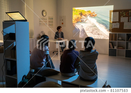 Schoolkids watching movie about natural environment Schoolkids watching movie about natural environment 81107583