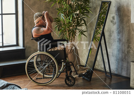 Person in Wheelchair Looking at Mirror Person in Wheelchair Looking at Mirror 81108031