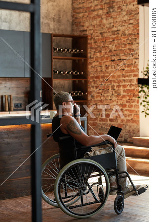 Modern Woman with Disability Working from Home 81108085