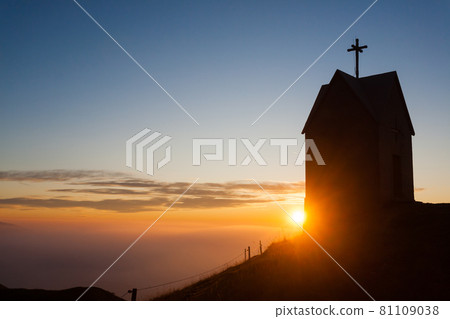Dawn at the little church, mount Grappa landscape, Italy 81109038
