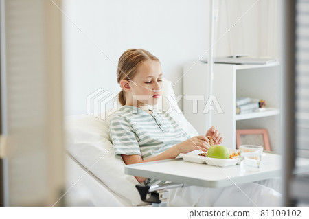 Child Eating Breakfast in Hospital Room 81109102