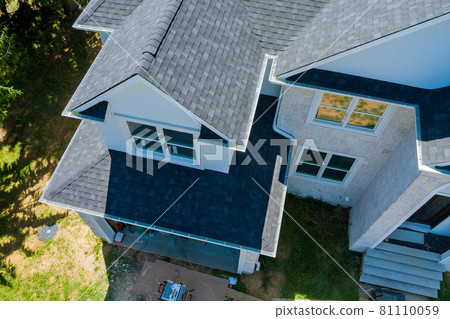Rooftop in a newly home constructed showing asphalt shingles multiple roof lines Rooftop in a newly home constructed showing asphalt shingles multiple roof lines 81110059
